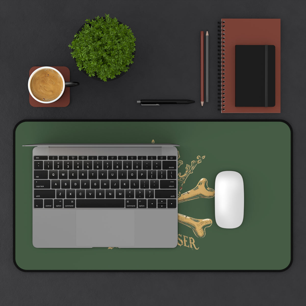 Blessed Loser Desk Mat — Crown & Crossbones Green Gaming/Office Mouse Pad on a workspace with laptop and coffee.