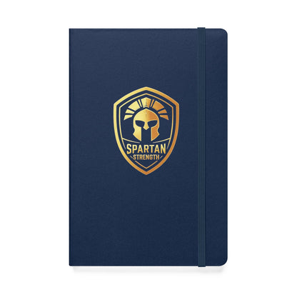 Spartan Strength Hardcover Notebook – Little Black Book for Fitness & Motivation in navy with gold emblem.