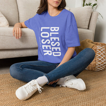 Blessed Loser T-Shirt | Vertical Bold Text Graphic Tee worn by a woman sitting casually on a couch.